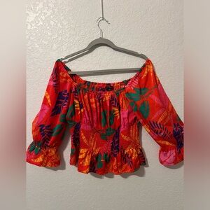 skies are blue. size medium. and has a tropical pattern